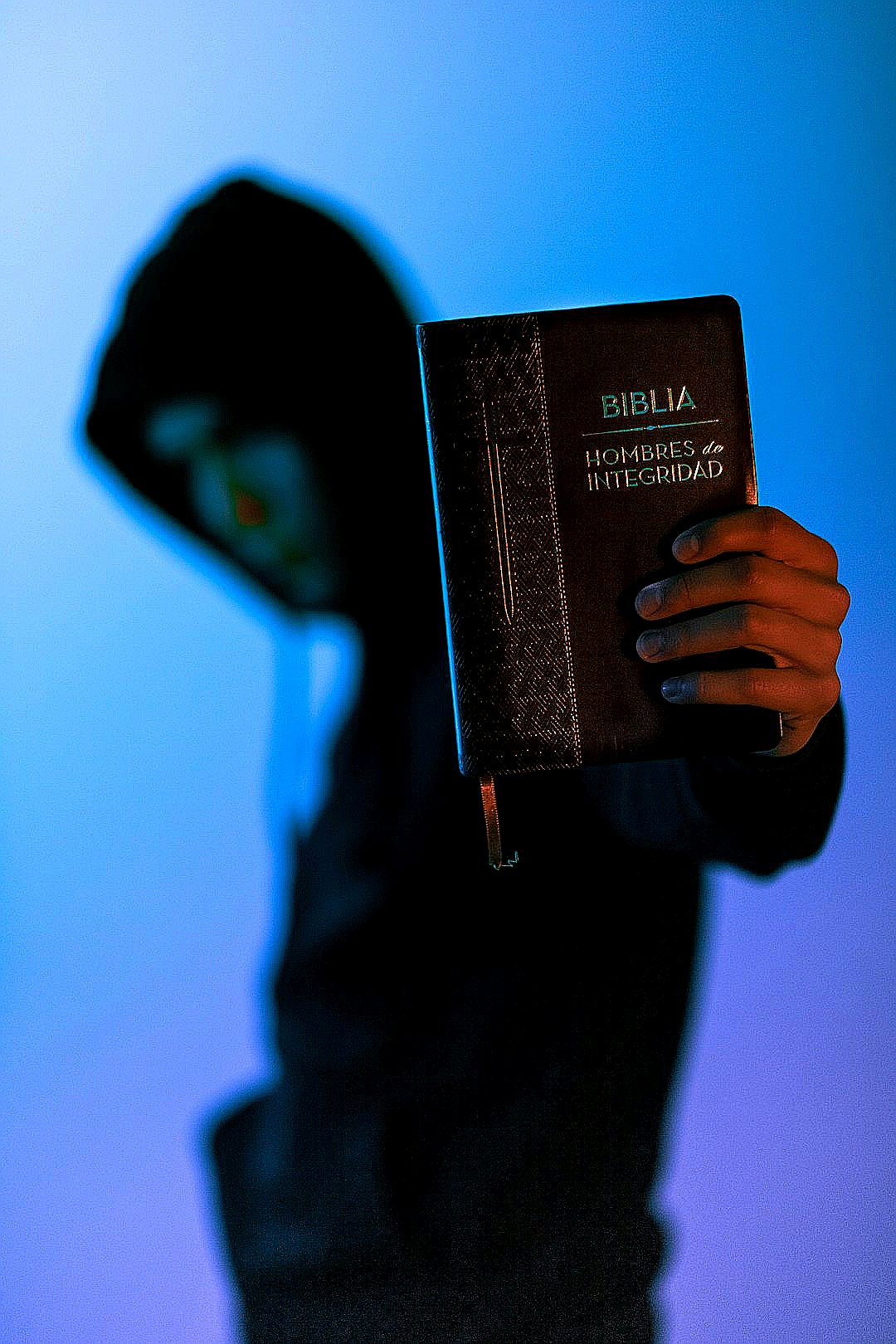 man holding Bible