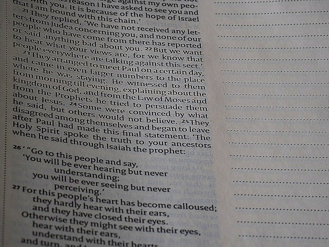 A close up of an open book with words on it