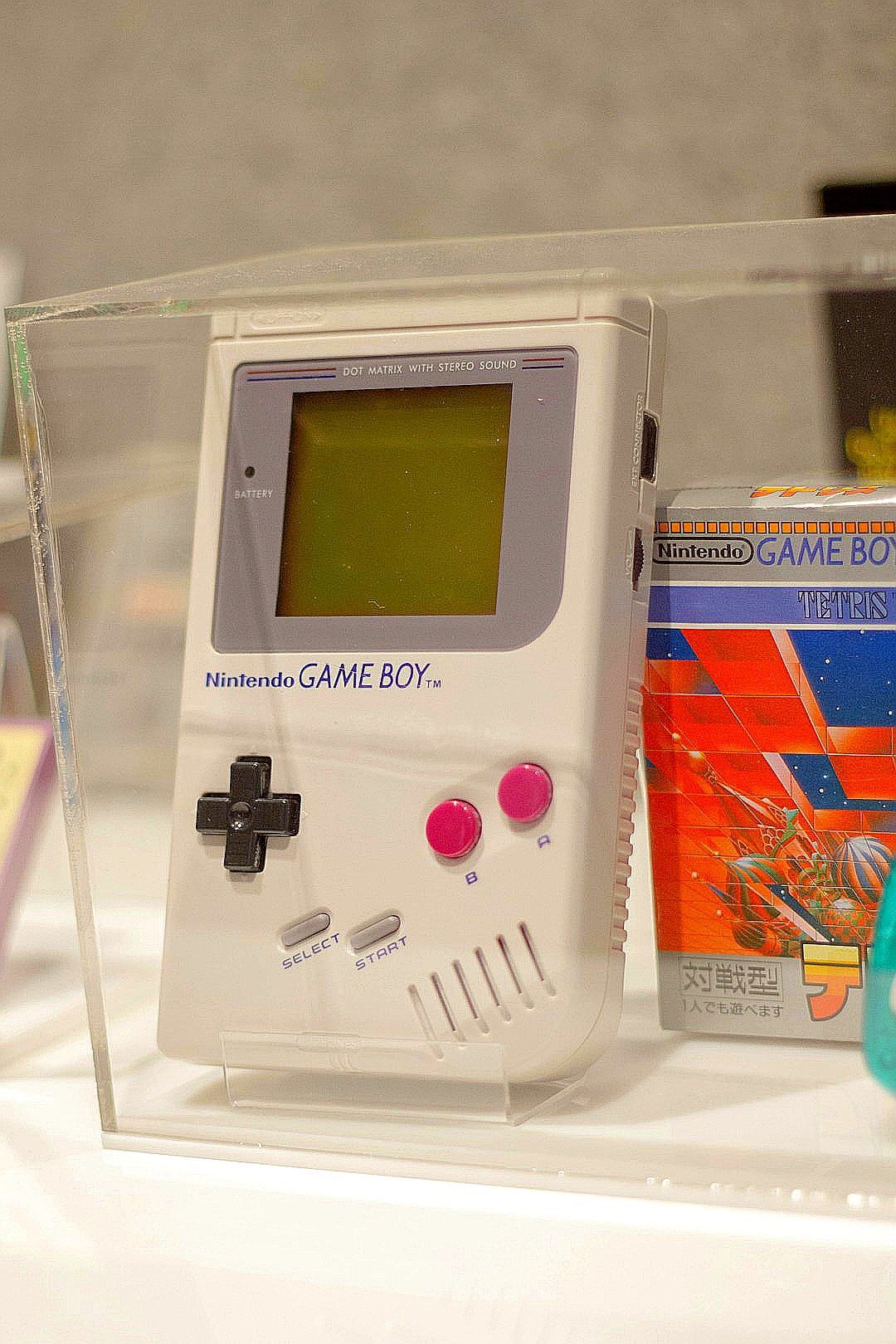 An original nintendo game boy is on display.