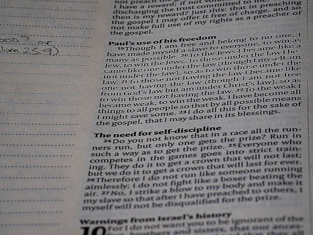 A close up of an open book with writing on it