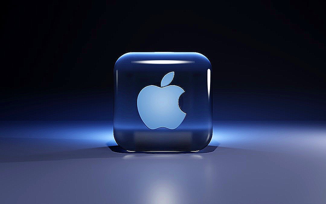 A translucent blue glass cube with an apple logo inside on a surface
