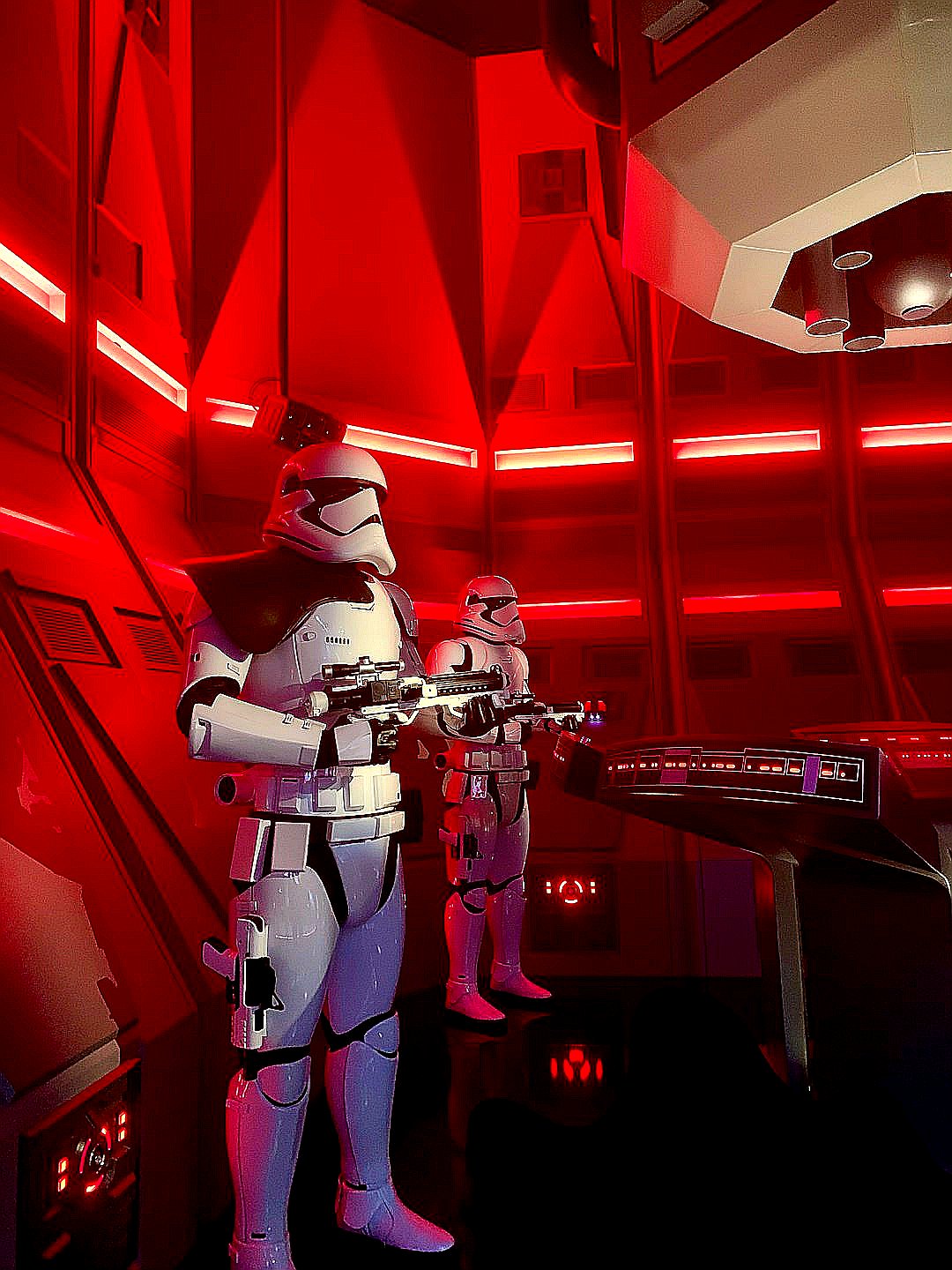 a couple of star wars characters standing next to each other