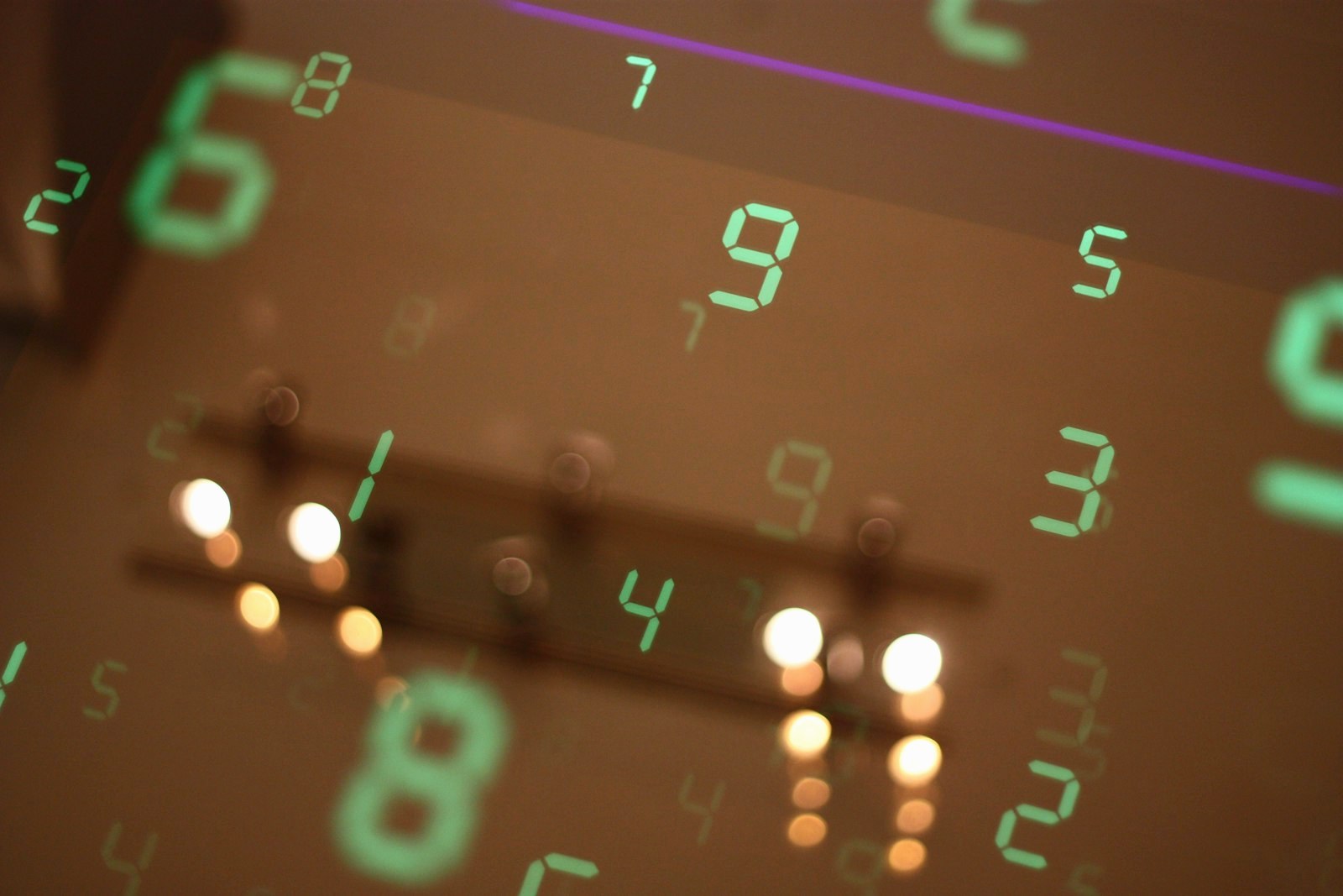 Numbers are reflected on a surface, blurring the image