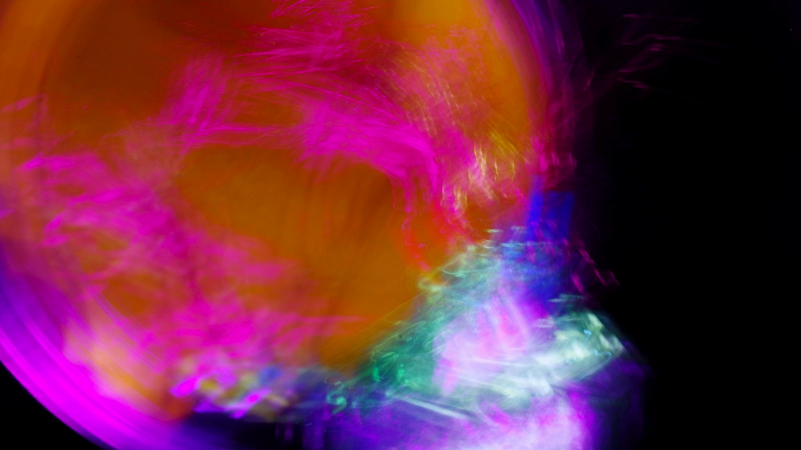 A blurry photo of a yellow and purple object