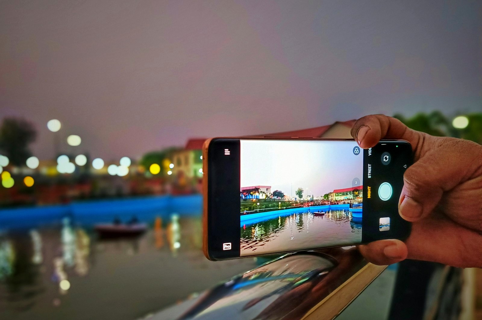 a person taking a picture with a cell phone