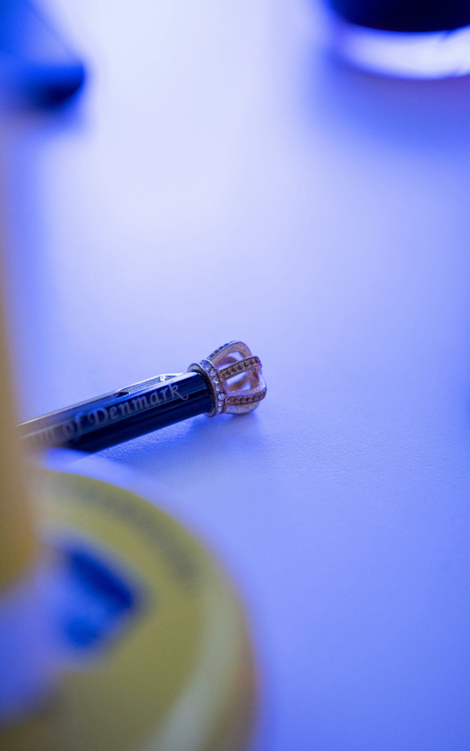 a close up of a pen on a table