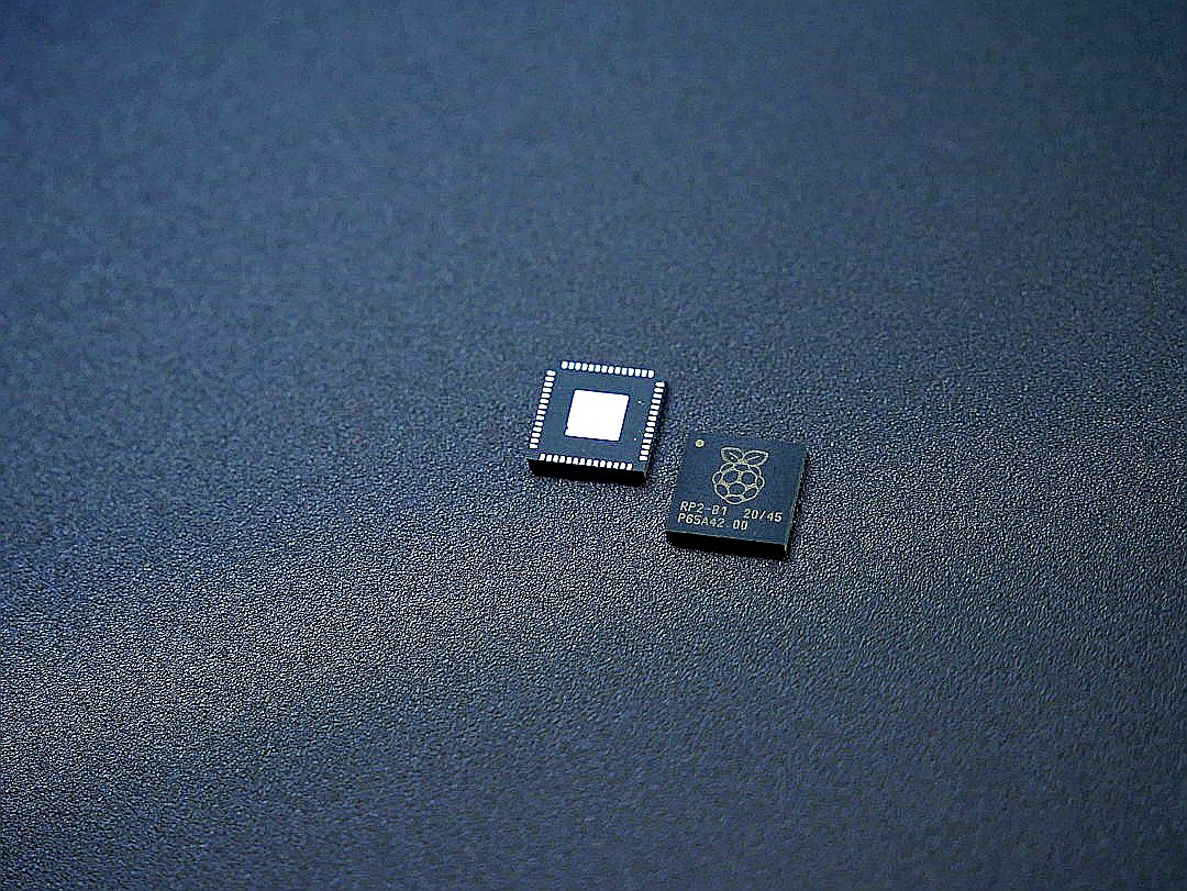 a couple of microchips sitting on top of a table