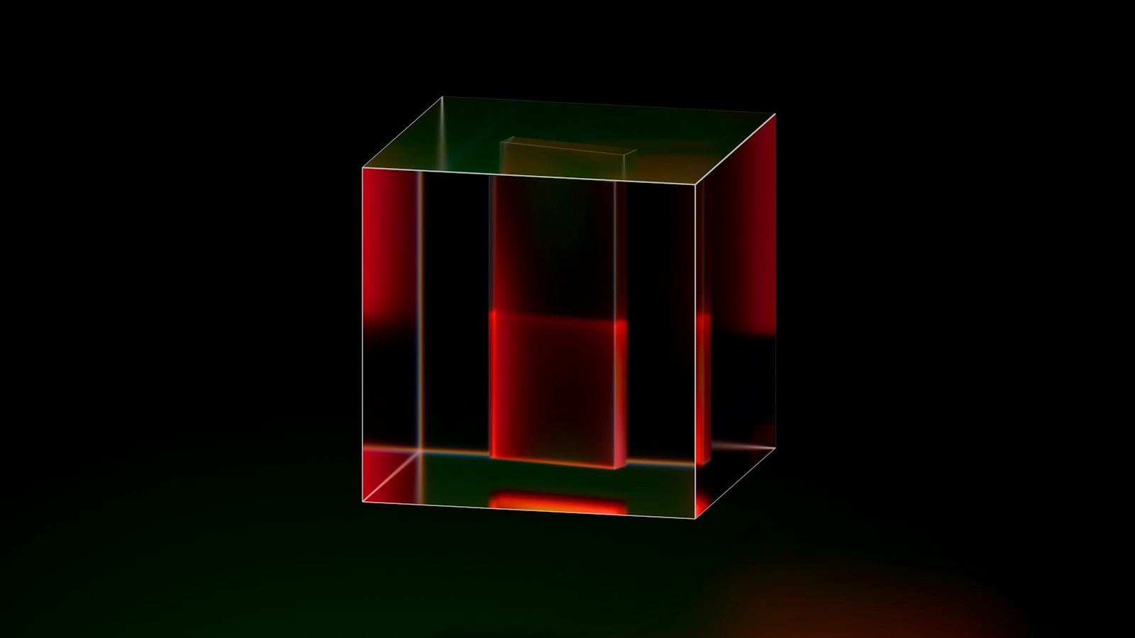 A red and green cube on a black background