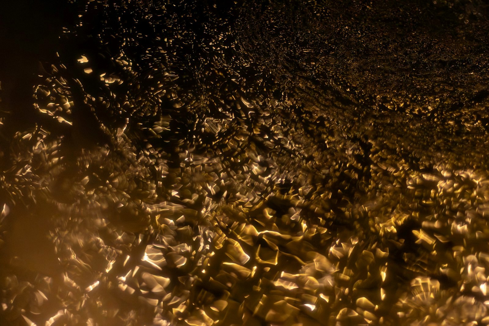 Abstract textured background with golden and dark brown colors