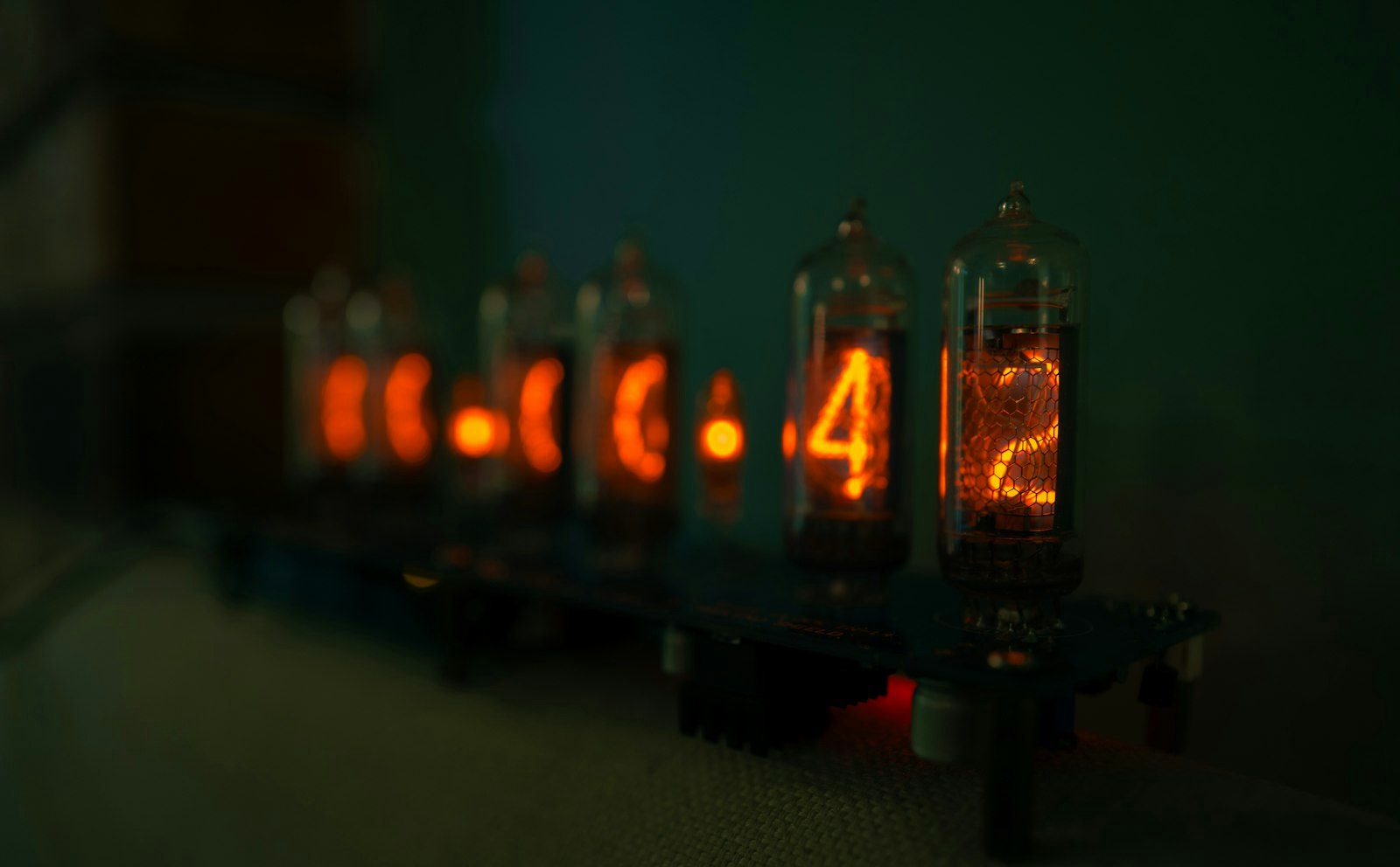 Vintage nixie tube clock displays glowing orange numbers