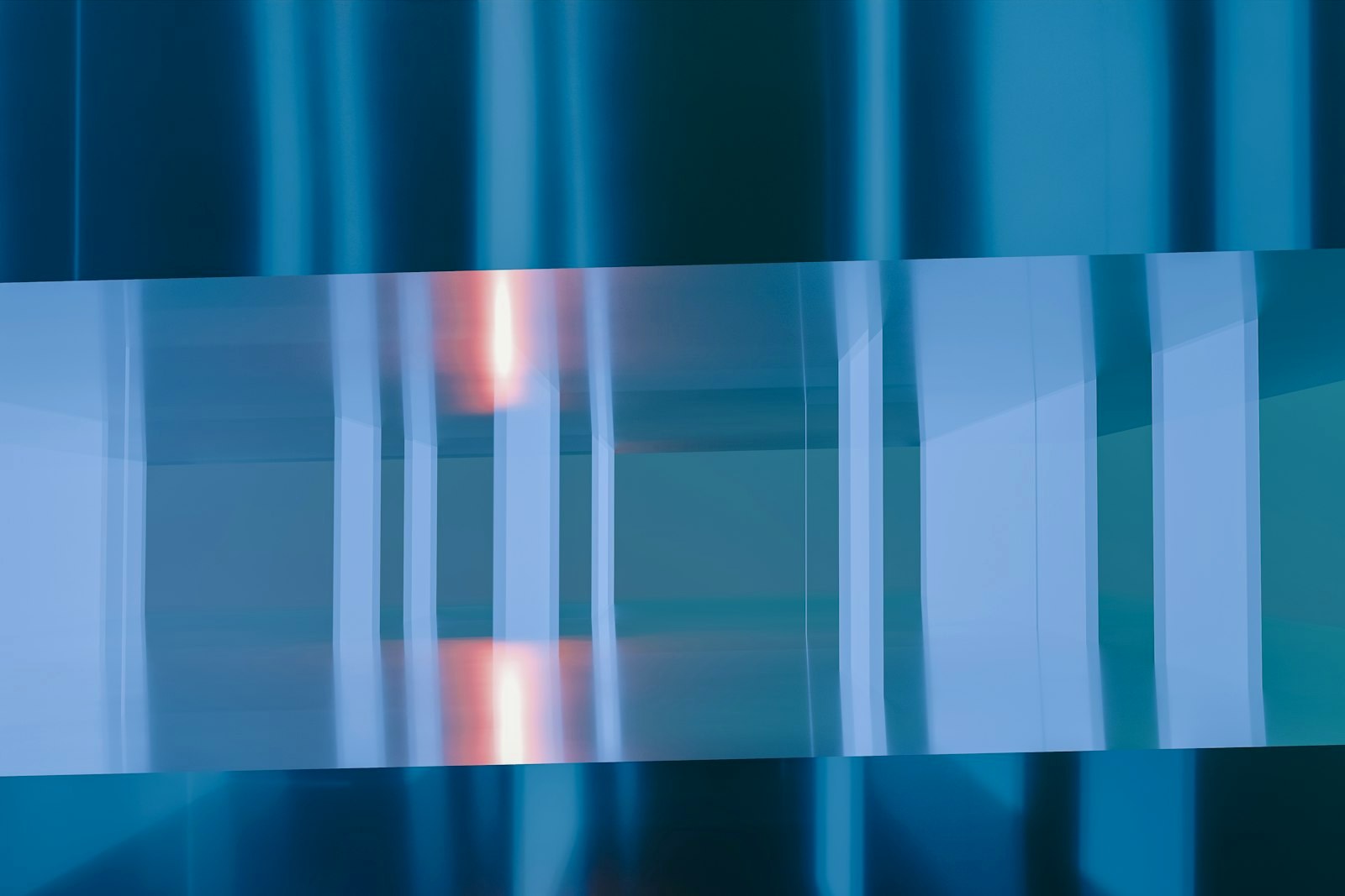 A blurry image of a blue and white wall